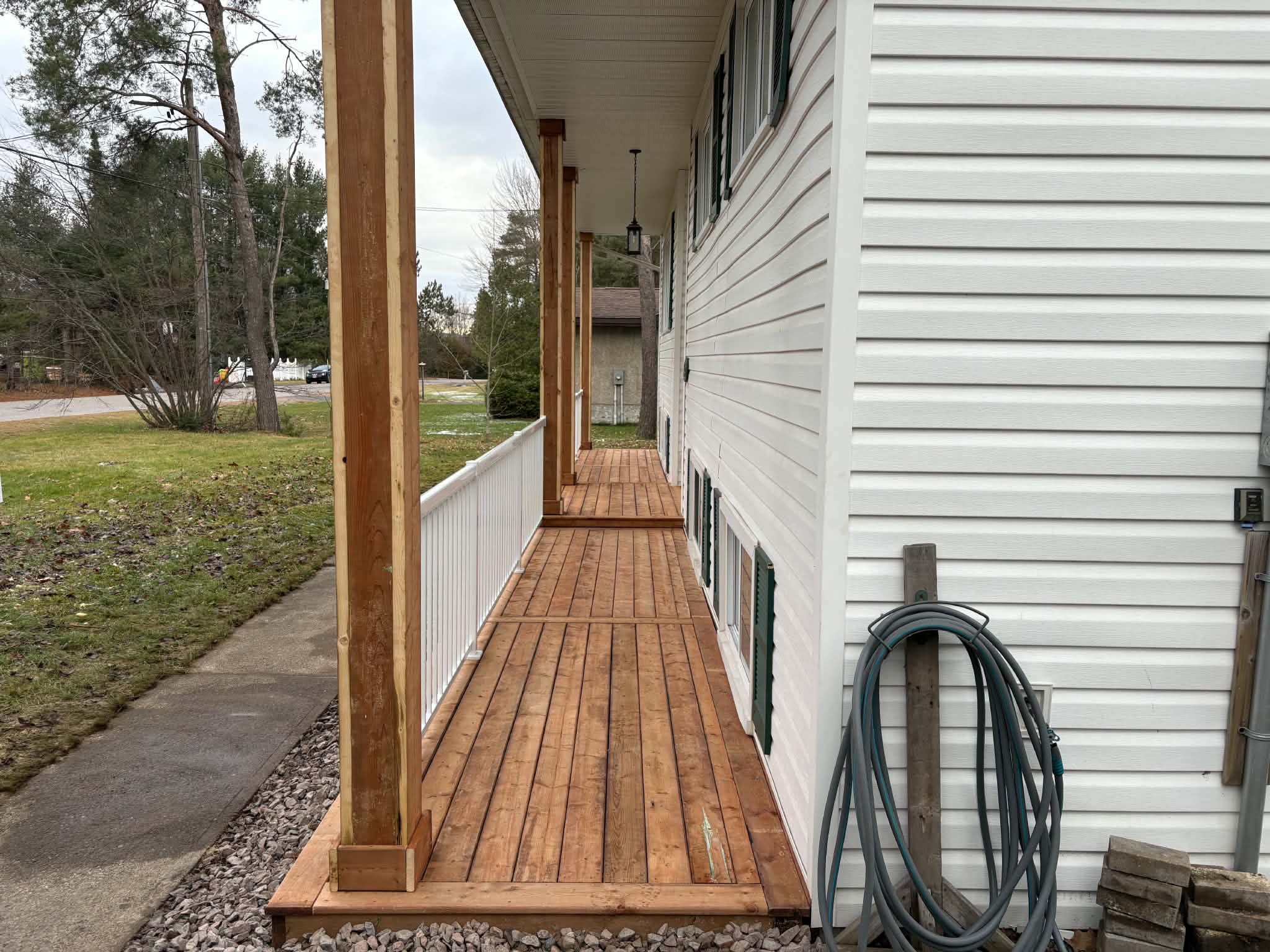 The finished wood porch rebuilt by PMK Construction
